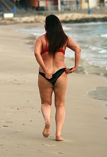 Reality star Lisa Appleton nipple slip on a beach in Spain