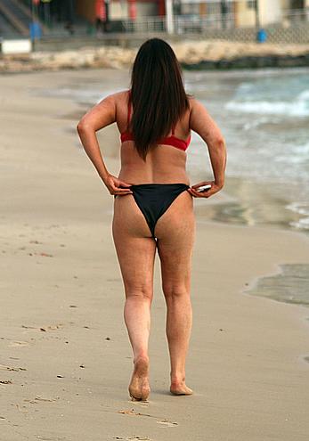 Reality star Lisa Appleton nipple slip on a beach in Spain