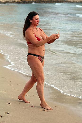 Reality star Lisa Appleton nipple slip on a beach in Spain