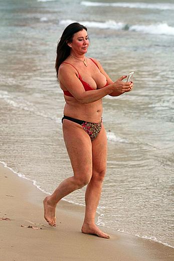 Reality star Lisa Appleton nipple slip on a beach in Spain