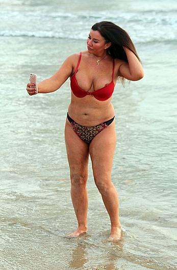 Reality star Lisa Appleton nipple slip on a beach in Spain