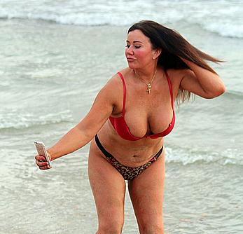 Reality star Lisa Appleton nipple slip on a beach in Spain