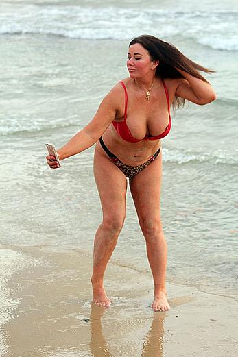 Reality star Lisa Appleton nipple slip on a beach in Spain