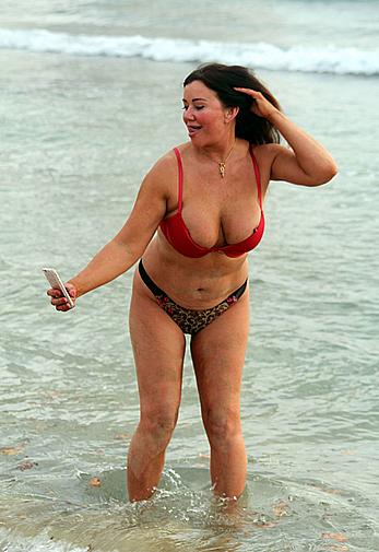 Reality star Lisa Appleton nipple slip on a beach in Spain