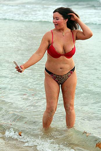 Reality star Lisa Appleton nipple slip on a beach in Spain