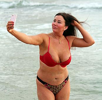 Reality star Lisa Appleton nipple slip on a beach in Spain