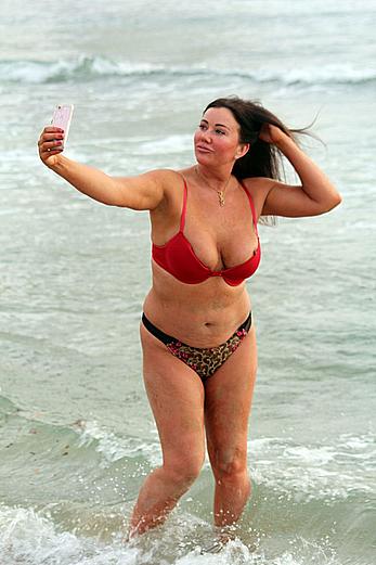 Reality star Lisa Appleton nipple slip on a beach in Spain