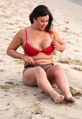 Reality star Lisa Appleton nipple slip on a beach in Spain