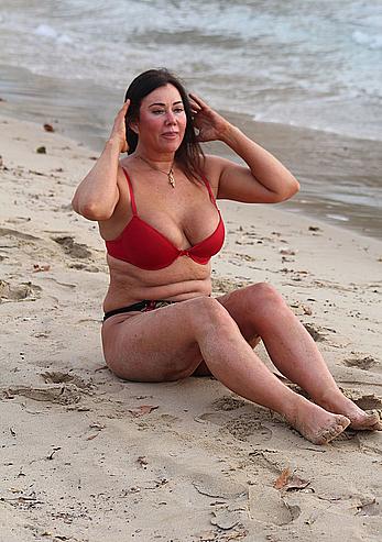 Reality star Lisa Appleton nipple slip on a beach in Spain