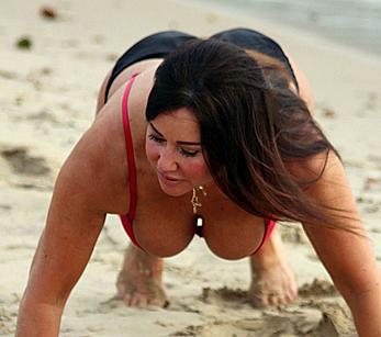 Reality star Lisa Appleton nipple slip on a beach in Spain