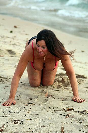 Reality star Lisa Appleton nipple slip on a beach in Spain