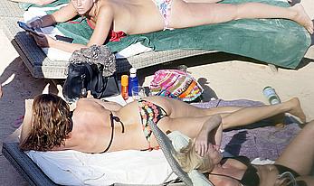 Lisa Snowdon on the beach in Ibiza boob peek