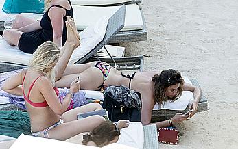 Lisa Snowdon on the beach in Ibiza boob peek