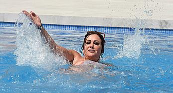 Lisa Appleton boobs out in a pool paparazzi shots