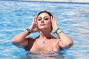 Lisa Appleton boobs out in a pool paparazzi shots