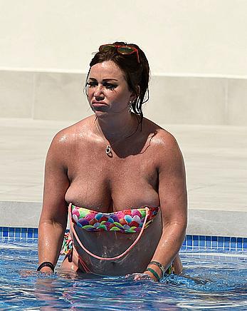 Lisa Appleton boobs out in a pool paparazzi shots