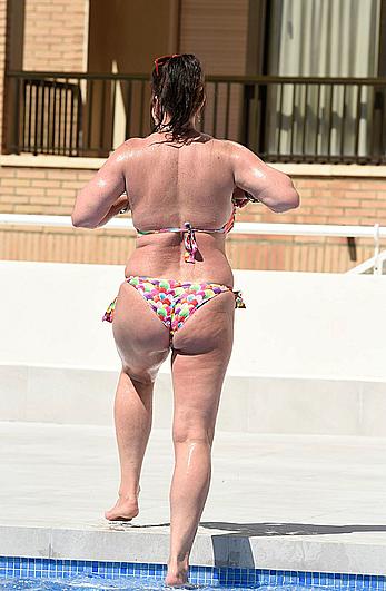 Lisa Appleton boobs out in a pool paparazzi shots