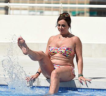 Lisa Appleton boobs out in a pool paparazzi shots