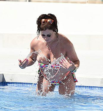 Lisa Appleton boobs out in a pool paparazzi shots