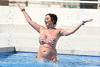 Lisa Appleton boobs out in a pool paparazzi shots