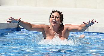 Lisa Appleton boobs out in a pool paparazzi shots