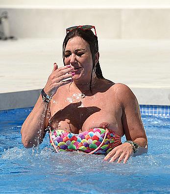 Lisa Appleton boobs out in a pool paparazzi shots