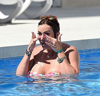 Lisa Appleton boobs out in a pool paparazzi shots