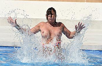 Lisa Appleton boobs out in a pool paparazzi shots