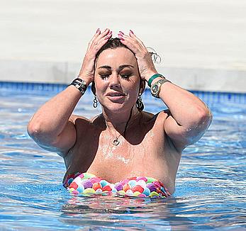 Lisa Appleton boobs out in a pool paparazzi shots