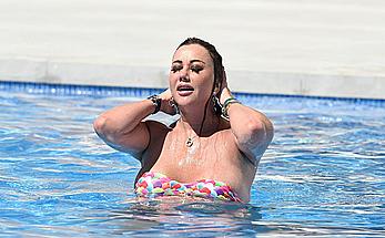 Lisa Appleton boobs out in a pool paparazzi shots