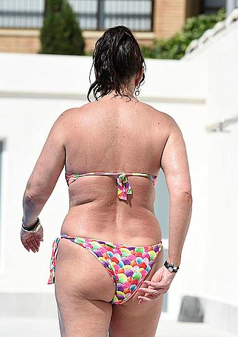 Lisa Appleton boobs out in a pool paparazzi shots