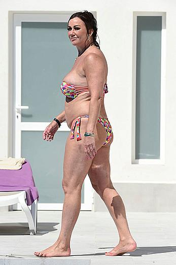 Lisa Appleton boobs out in a pool paparazzi shots