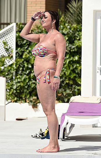 Lisa Appleton boobs out in a pool paparazzi shots