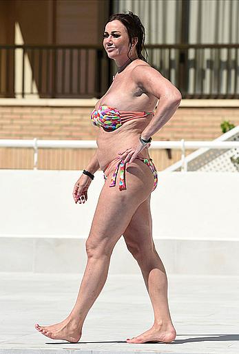 Lisa Appleton boobs out in a pool paparazzi shots