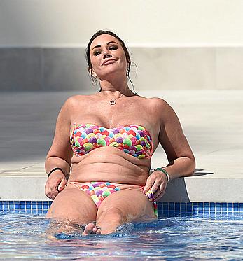 Lisa Appleton boobs out in a pool paparazzi shots