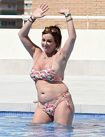 Lisa Appleton boobs out in a pool paparazzi shots