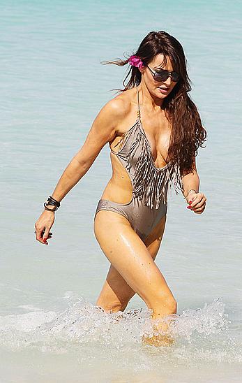 Lizzie Cundy wearing a one-piece swimsuit in Barbados