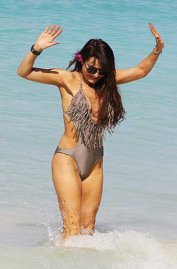 Lizzie Cundy wearing a one-piece swimsuit in Barbados