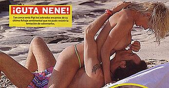 Lucia Lapiedra topless on a beach paparazzi shots