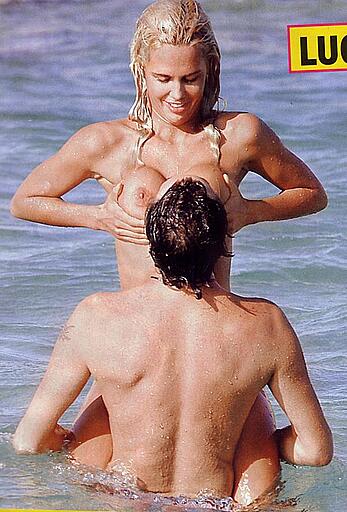 Lucia Lapiedra topless on a beach paparazzi shots