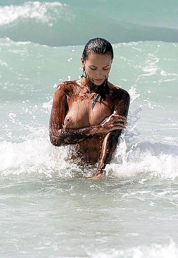 Lucy Clarkson topless and nude on a beach