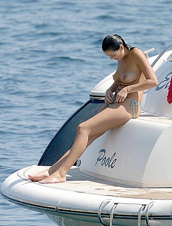 Lucy Clarkson topless in blue bikini pants on a yacht in Majorca