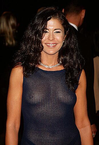 Maria Conchita Alonso braless in see through dress paparazzi photos