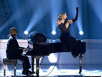 Mariah Carey deep cleavage in black dress while performs at The BET Honors-Washington DC at Warner Theater