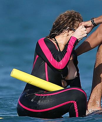 Mariah Carey boobslip wearing a wetsuit in Italy