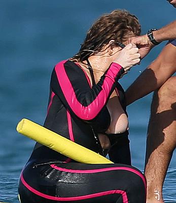 Mariah Carey boobslip wearing a wetsuit in Italy