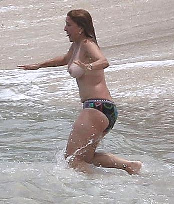 Judge Marilyn Milian caught topless at a Caribbean Beach