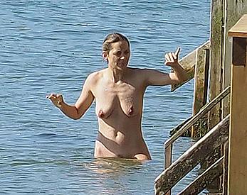 Marion Cotillard swimming fully nude in the ocean in Cap-Ferret