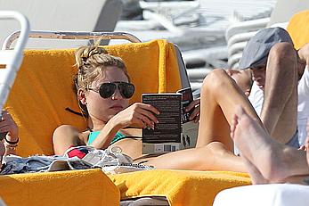 Martha Hunt sunbathing in bikini at the beach in Miami