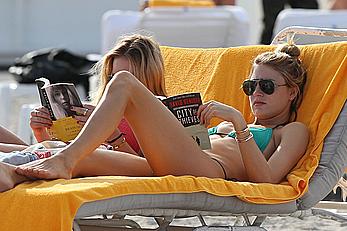 Martha Hunt sunbathing in bikini at the beach in Miami